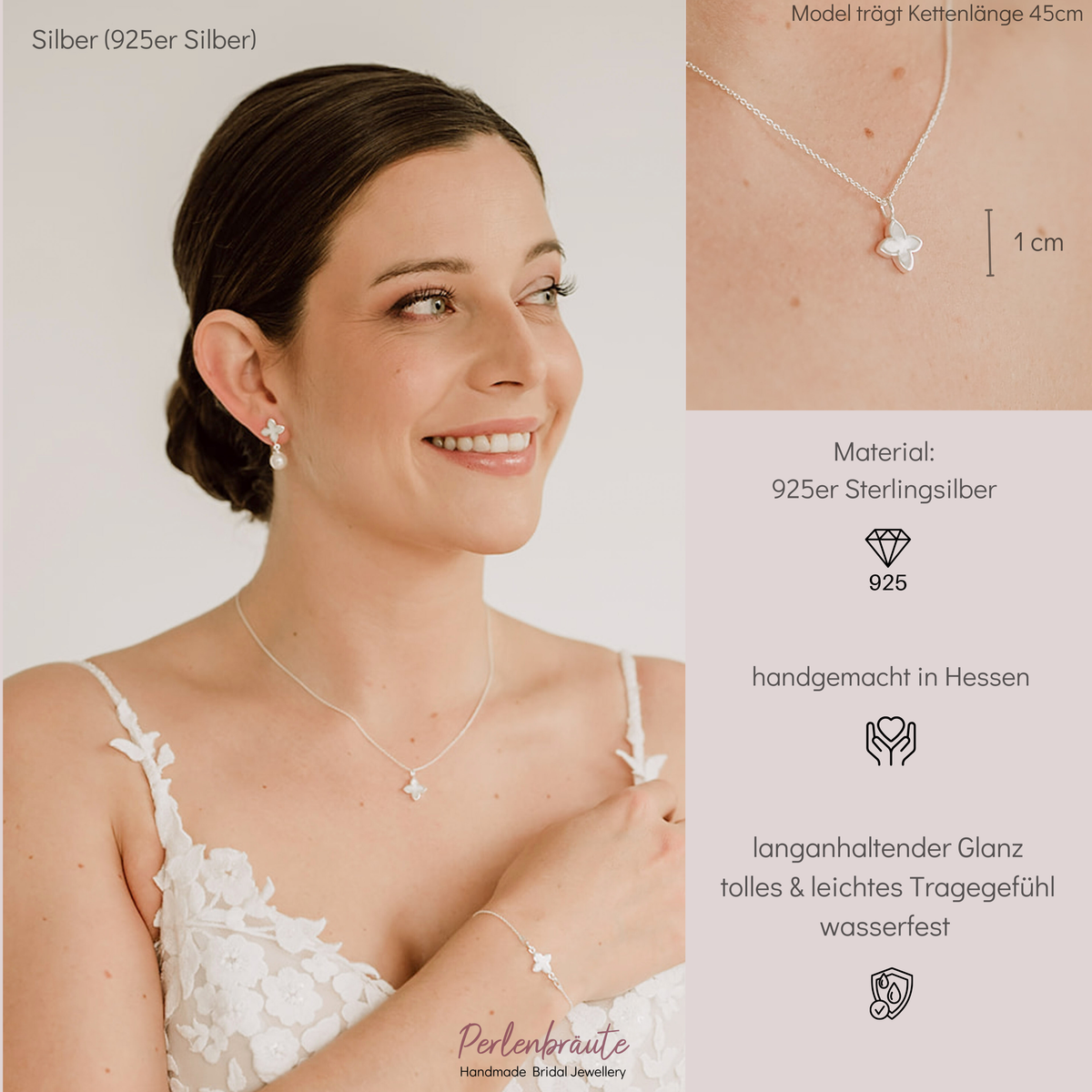 Brauthalskette Daisy aus 925 Sterlingsilber mit kleiner perlmuttfarbener Blüte, am Model getragen